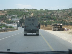 An Israeli military jeep that highly resembles the Nazi jeeps, driving in the Palestinian territory.